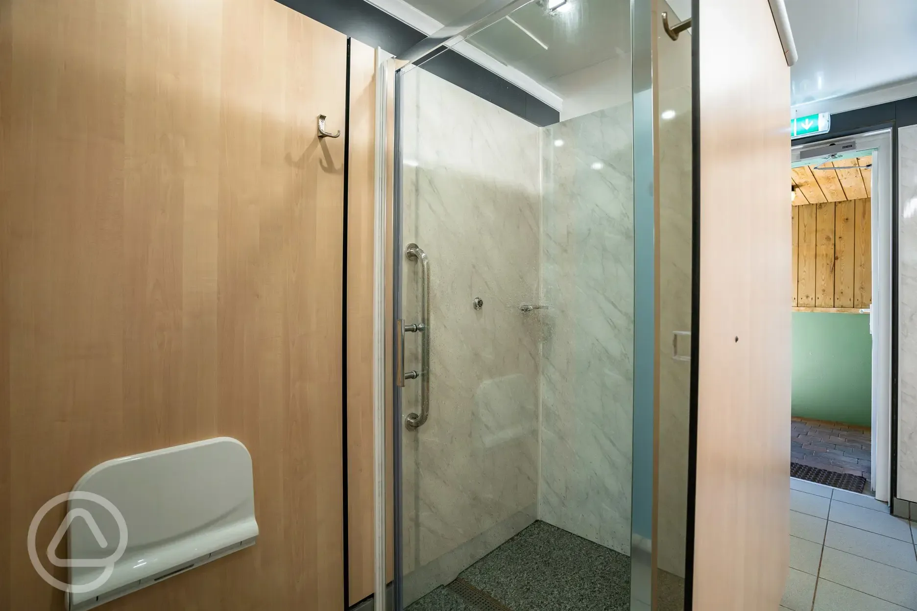Men's shower cubicles with a stool and hooks