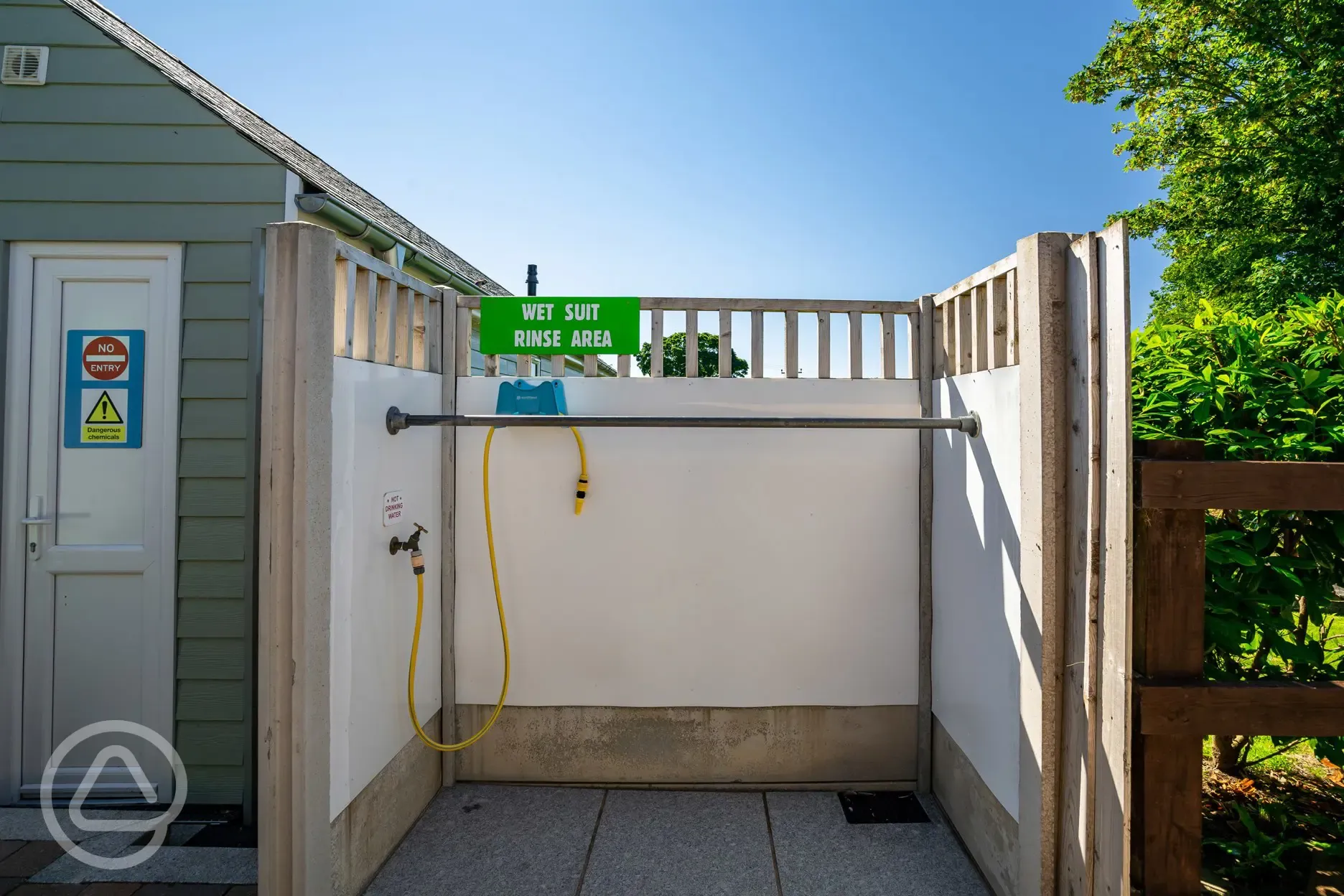 Outdoor wetsuit rinse area at Tregarton Park