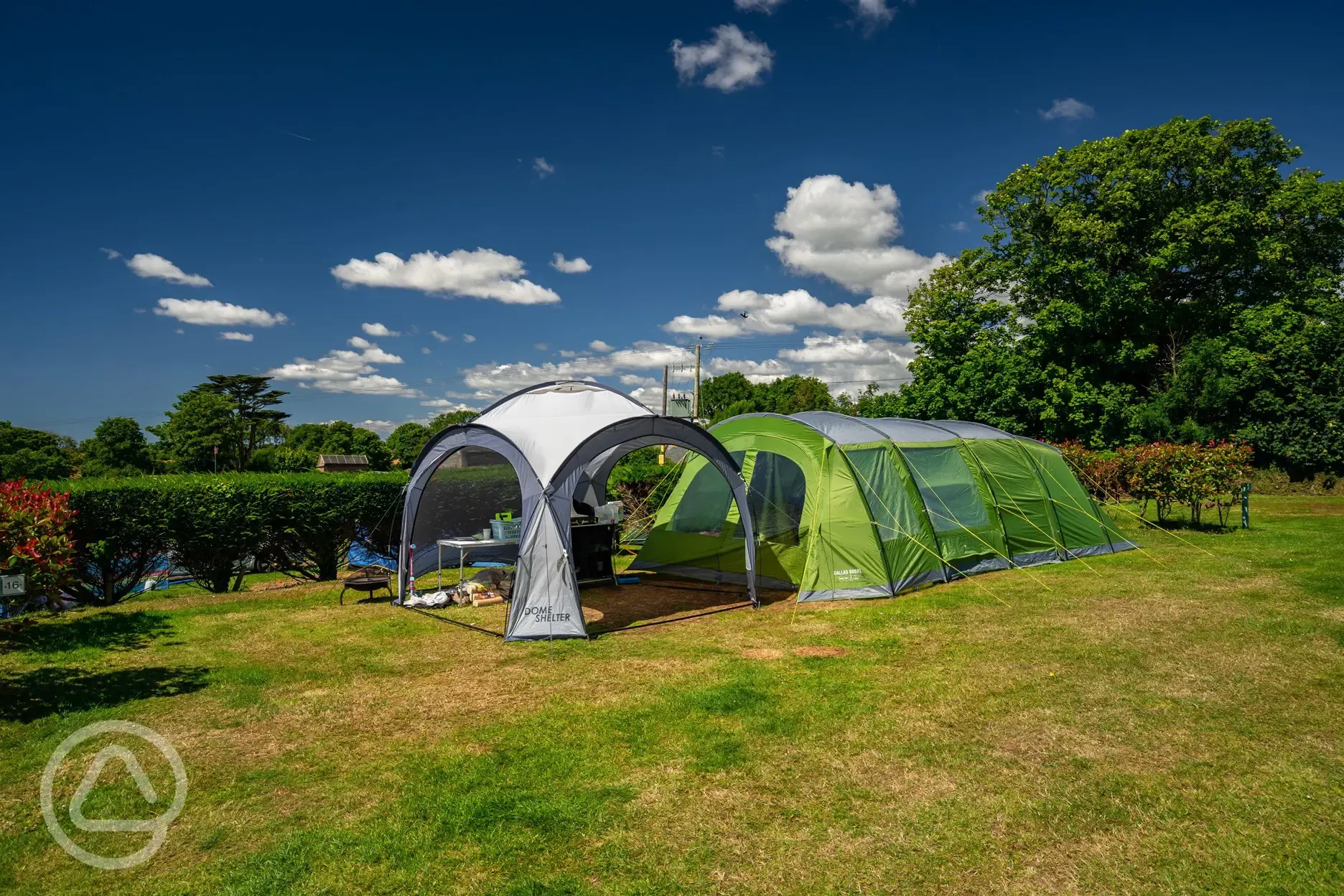 Tent and gazebo on grass pitches at Tregarton Park