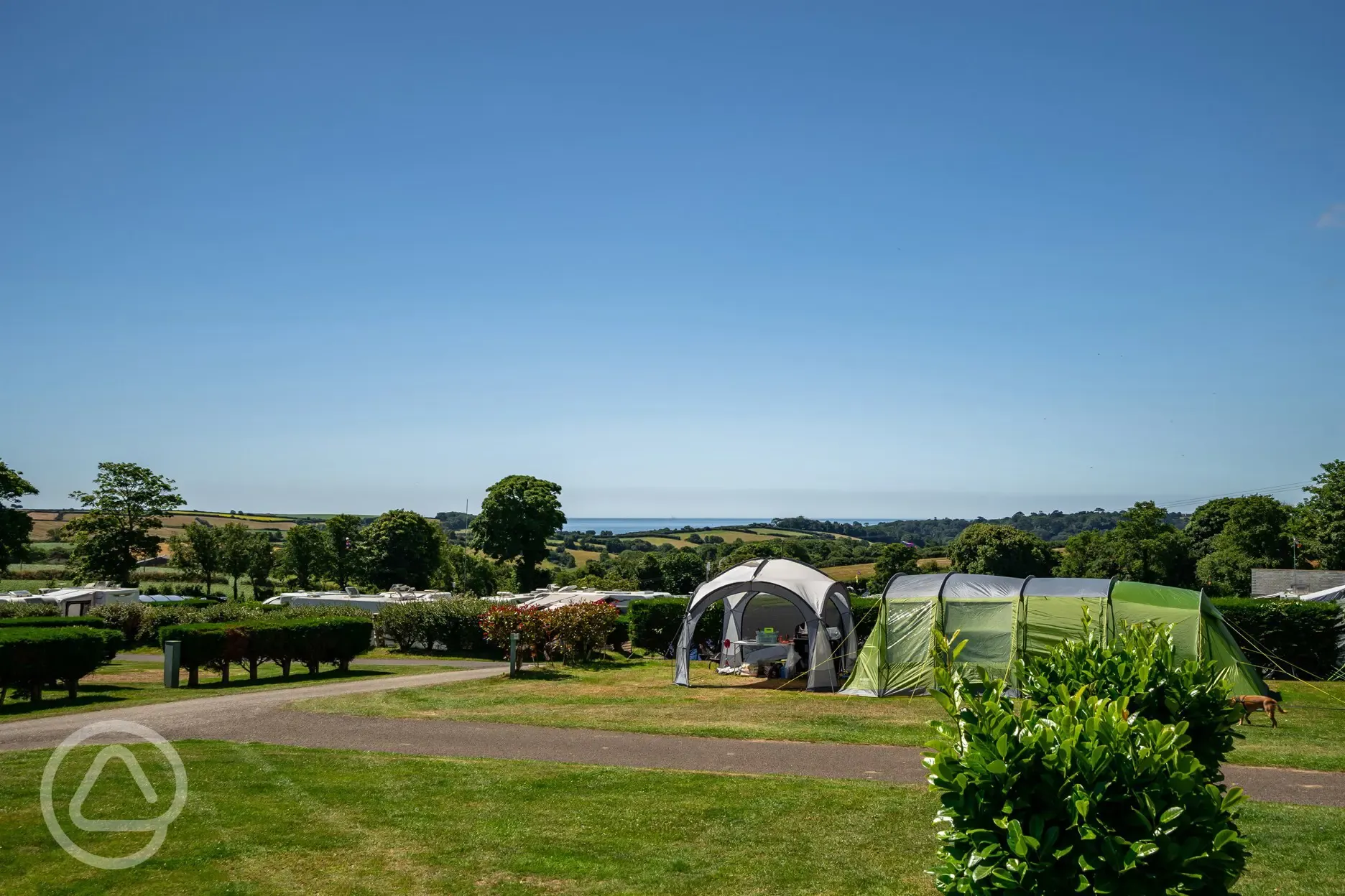 Tent and gazebo on grass pitches at Tregarton Park