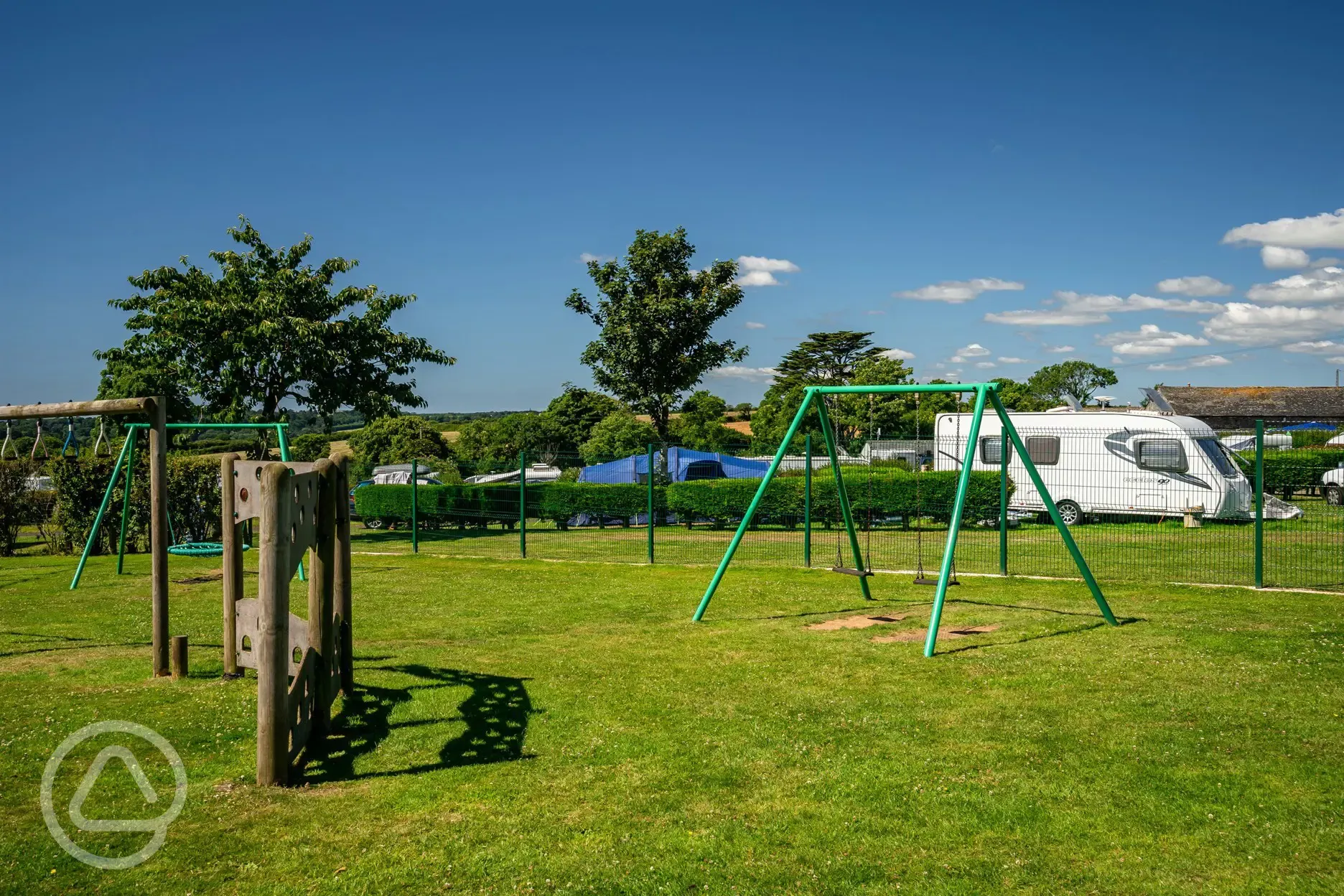 Kid's playground with swings and climbing at Tregarton Park