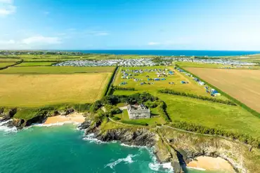 Aerial of Harlyn Sands Holiday Park by the coast