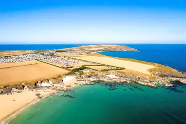 Aerial of Harlyn Sands Holiday Park by the coast