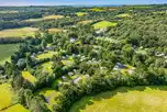 Aerial of Eden Valley Holiday Park with distant views of Par Beach