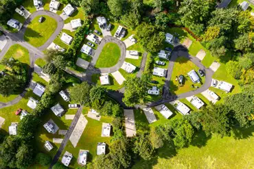 Aerial of the grass and hardstanding pitches at Eden Valley Holiday Park