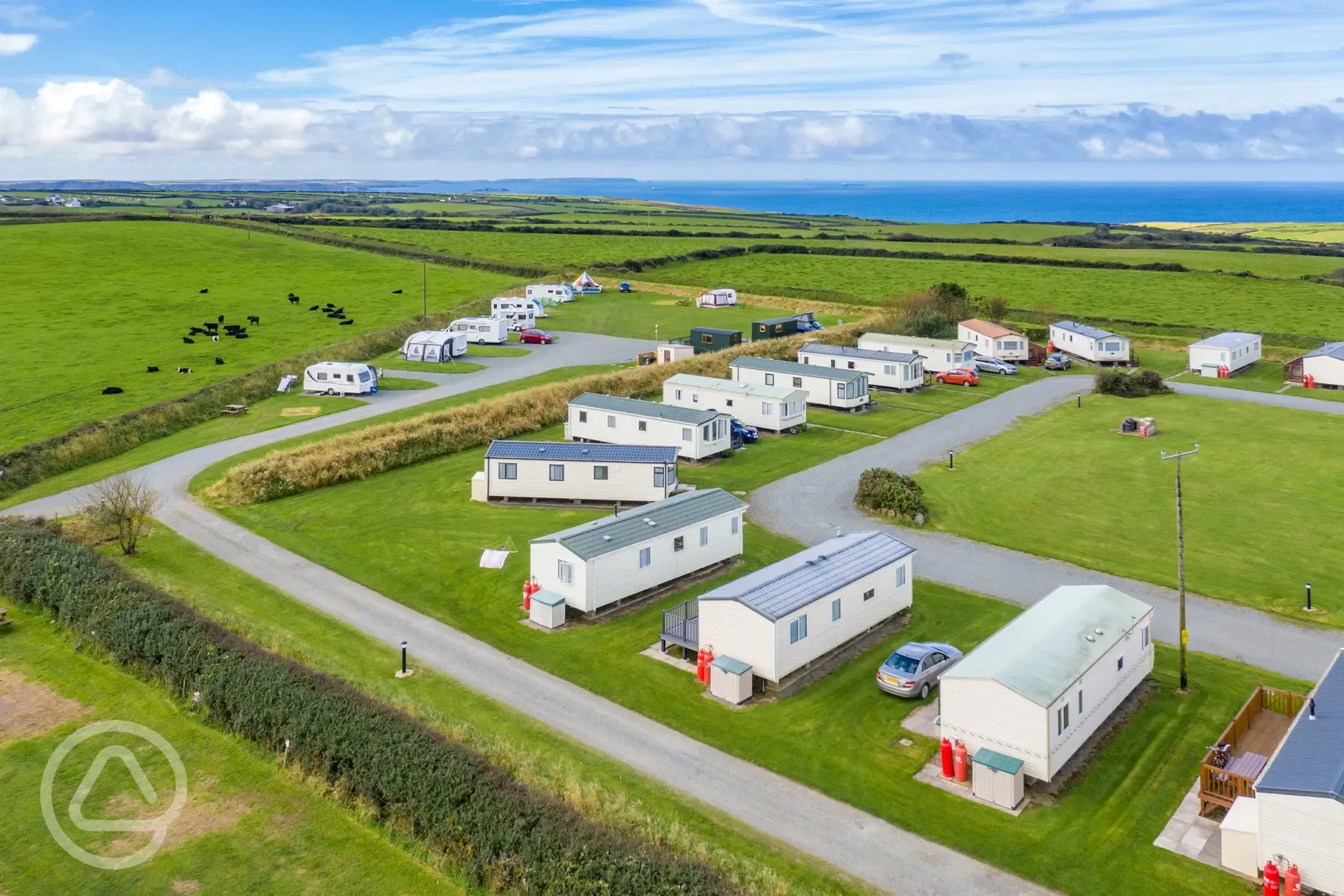 Aerial of the static caravans and hardstanding pitches by the sea