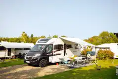 Fully serviced hardstanding touring pitches with electric, water, and grey waste