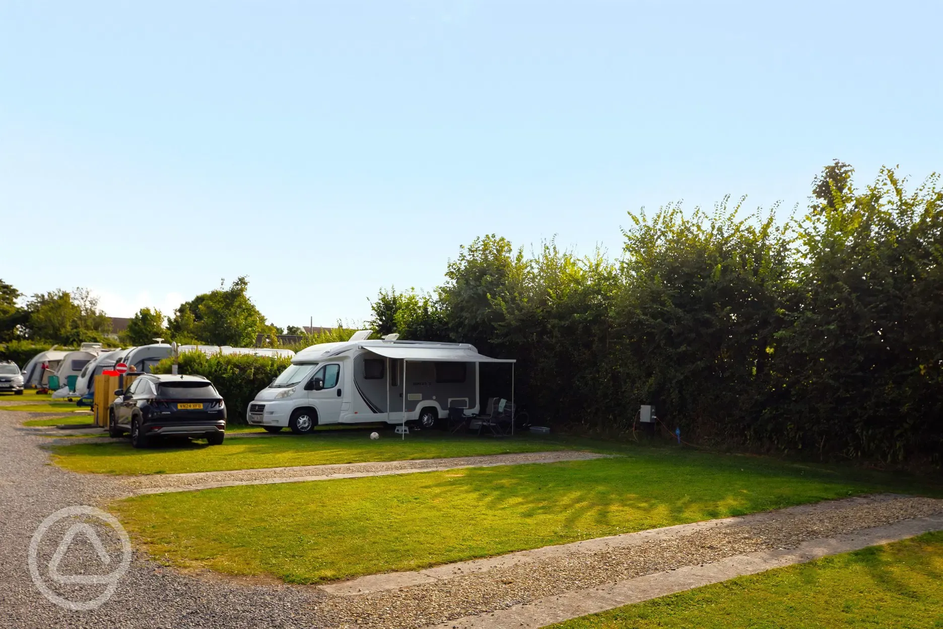 Electric partial hardstanding touring pitches