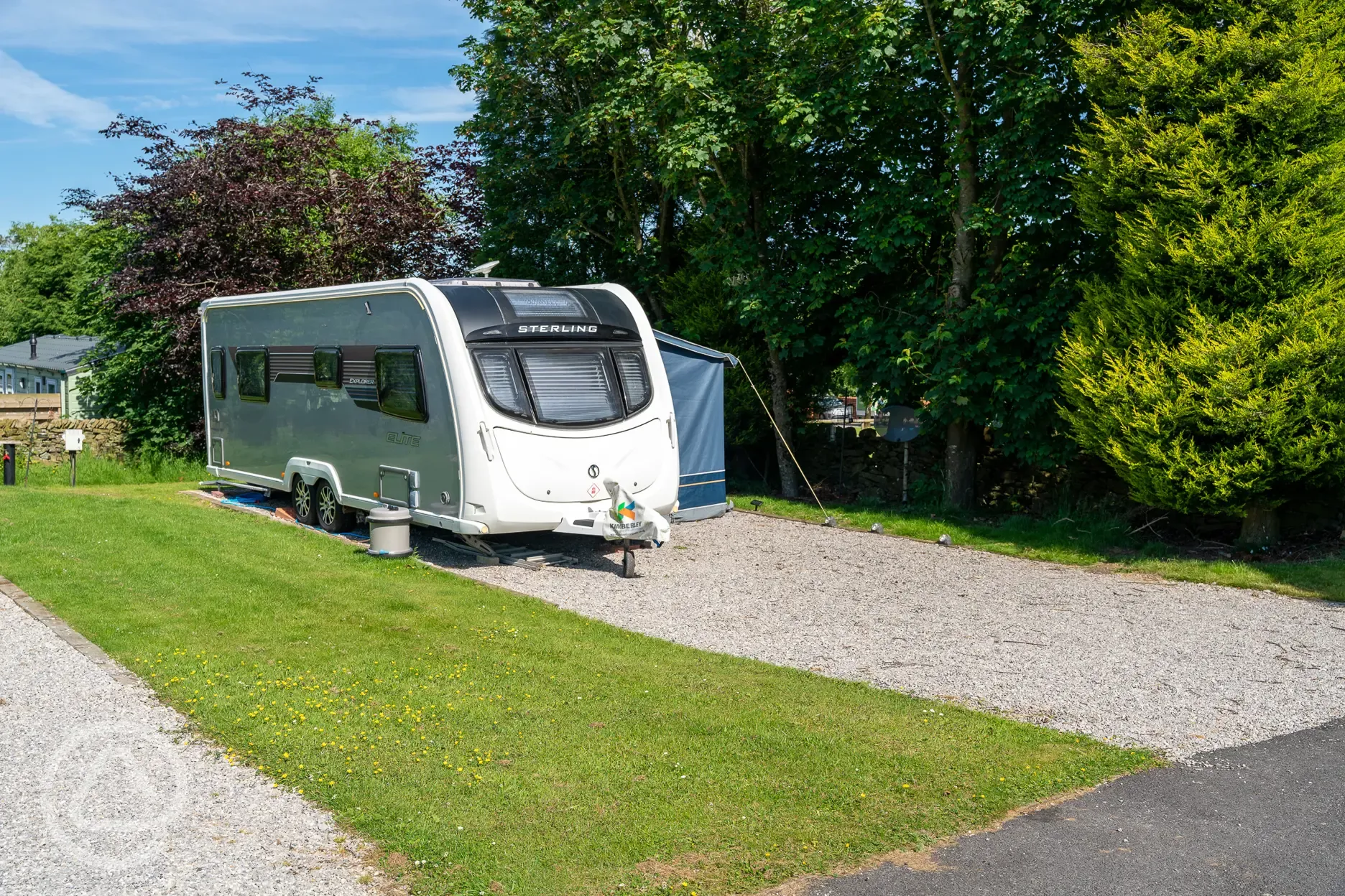 Tourer with awning on a hardstanding pitch Tourer with awning on a hardstanding pitch