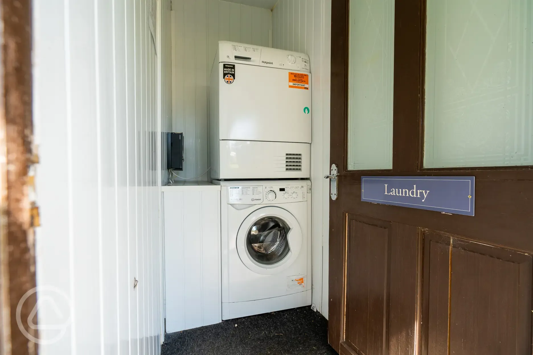 Laundry room with coin operated washing machines and dryers Laundry room with coin operated washing machines and dryers