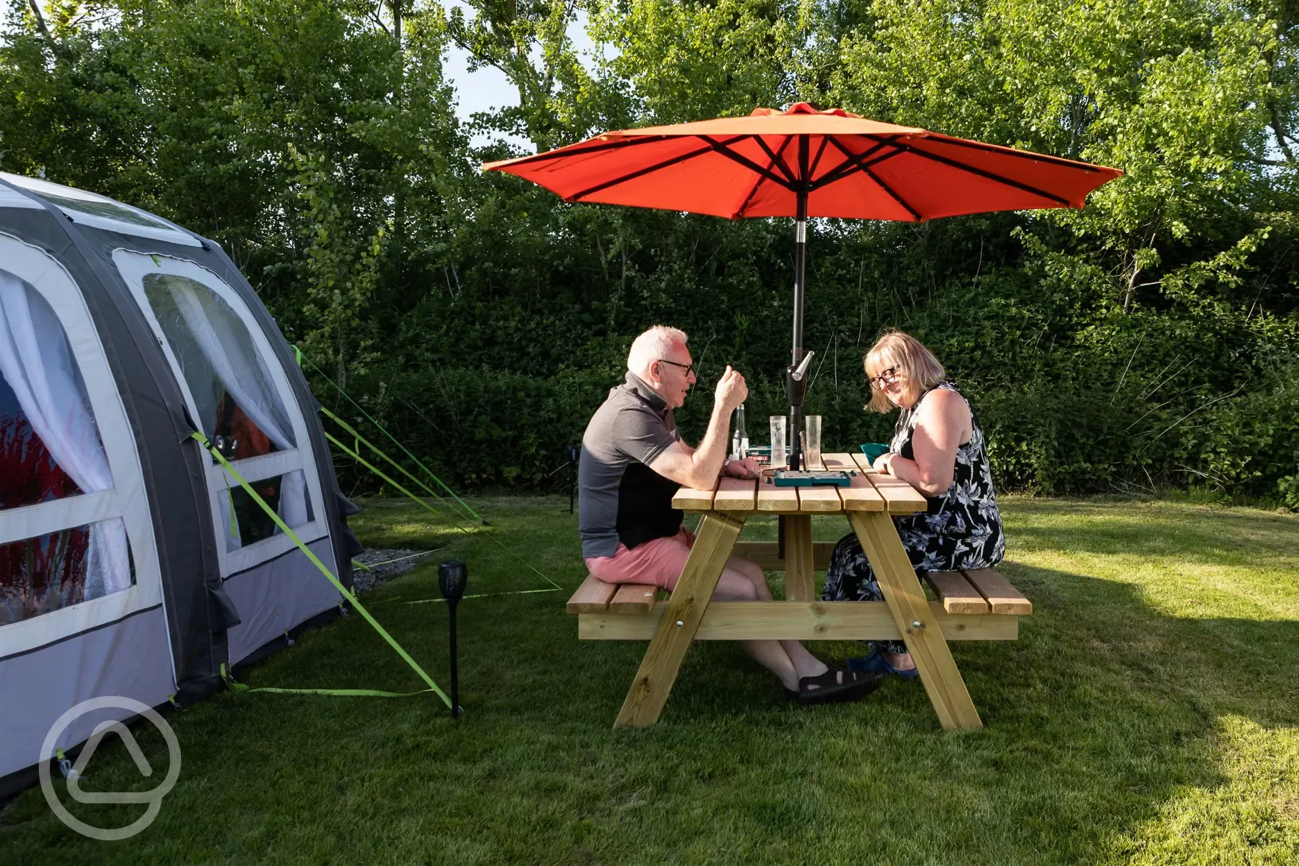 Picnic benches by the grass pitches