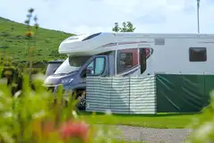 Fully serviced grass pitch with 16 amp hookup, water tap and grey water drainage