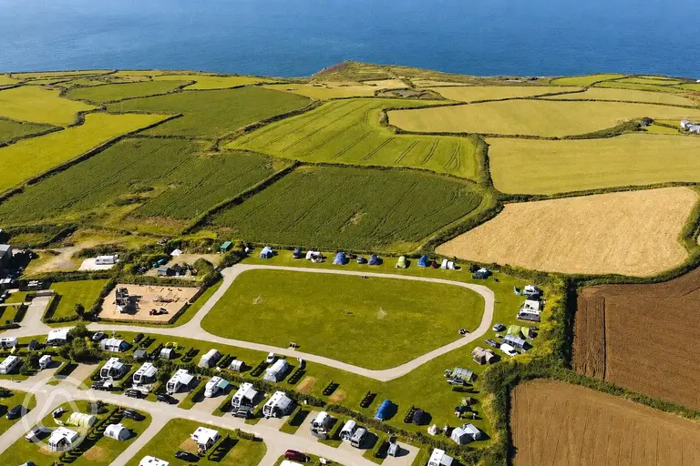 Aerial of Trevalgan Touring Park and the Cornish coast