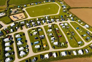 Aerial of Trevalgan Touring Park with hedged pitches