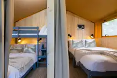 Safari tents with a double bedroom and triple bunk room (bedding provided) Safari tents with a double bedroom and triple bunk room (bedding provided)