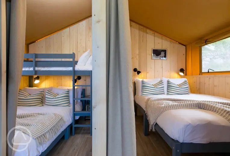 Safari tents with a double bedroom and triple bunk room (bedding provided)