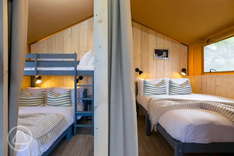 Safari tents with a double bedroom and triple bunk room (bedding provided)