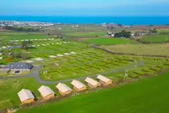 Aerial of the glamping safari tents Aerial of the glamping safari tents