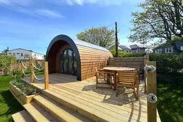 Preseli glamping pod with a large deck area and hot tub
