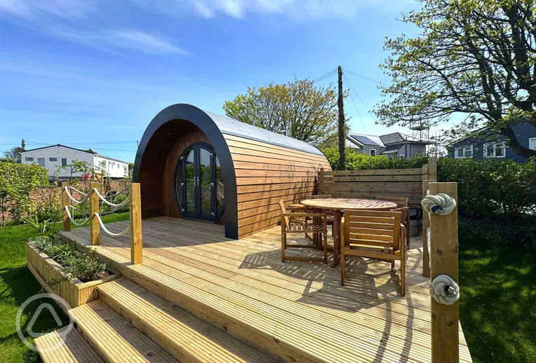 Preseli glamping pod with a large deck area and hot tub