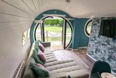 Glamping pod lodge L-shaped sofa with a smart TV Glamping pod lodge L-shaped sofa with a smart TV