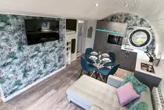 Glamping pod lodge with a sofa, dining area, kitchen and bunk beds Glamping pod lodge with a sofa, dining area, kitchen and bunk beds