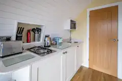 Luxury glamping pod kitchen with a hob, microwave, fridge, air fryer and kettle Luxury glamping pod kitchen with a hob, microwave, fridge, air fryer and kettle