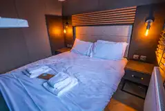 Designer studio suite double bedroom with bedding and towels provided Designer studio suite double bedroom with bedding and towels provided