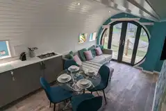 Glamping pod lodge with a sofa, dining area, kitchen and bunk beds Glamping pod lodge with a sofa, dining area, kitchen and bunk beds