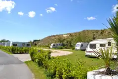 Fully serviced pitches with hedges between for added privacy
