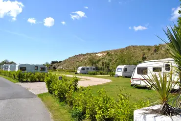 Fully serviced pitches with hedges between for added privacy