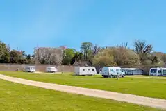 Electric grass touring pitches (8m x 10m) with 16 amp hook ups