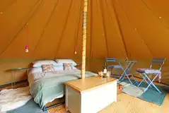 Bell tent interior with a double bed (including bedding) Bell tent interior with a double bed (including bedding)