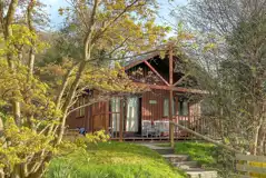 Lodge with an outdoor deck and hot tub Lodge with an outdoor deck and hot tub