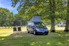 VW campervan on an electric grass pitch