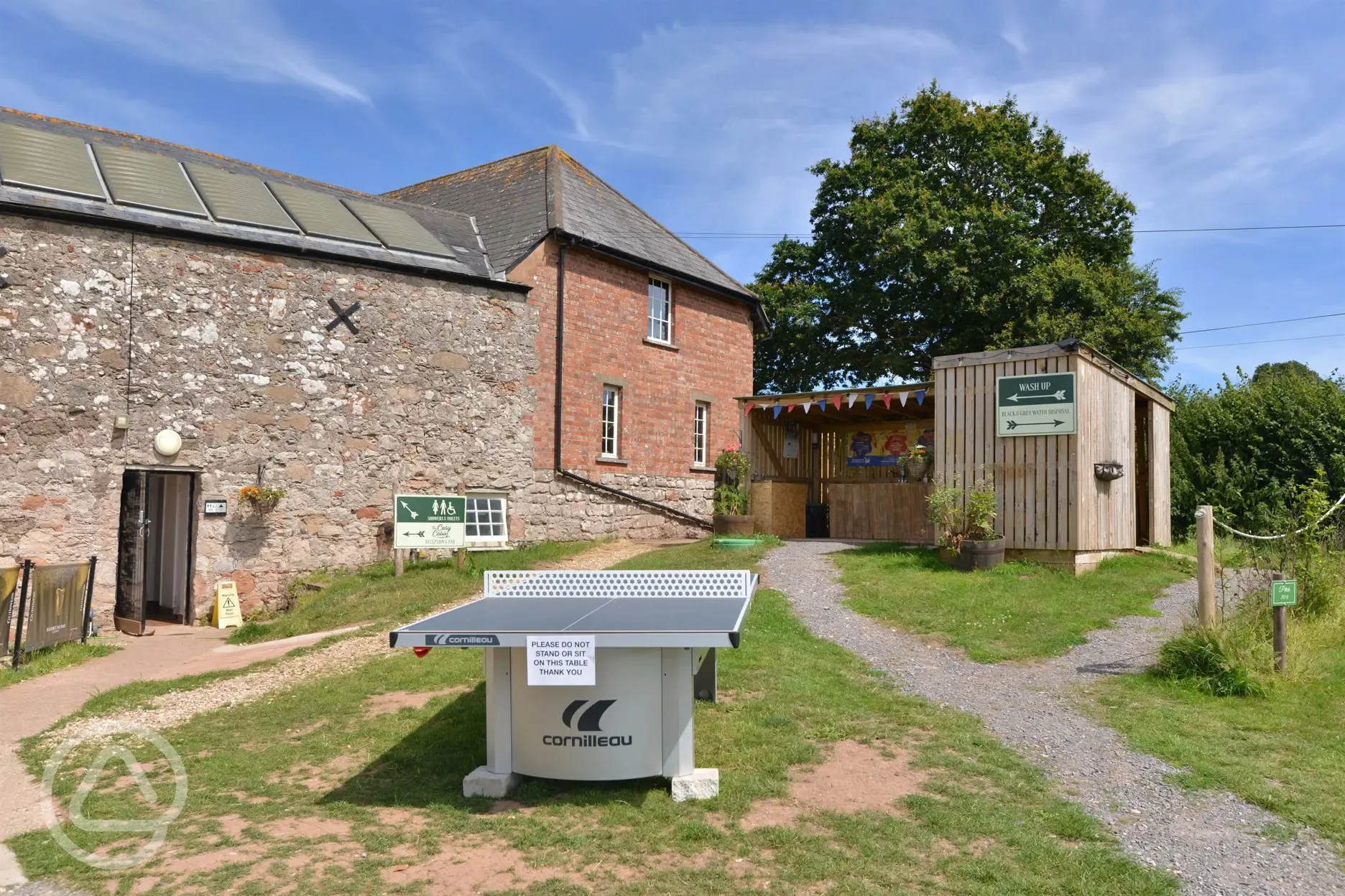 Facilities block, outdoor washing up area and table tennis
