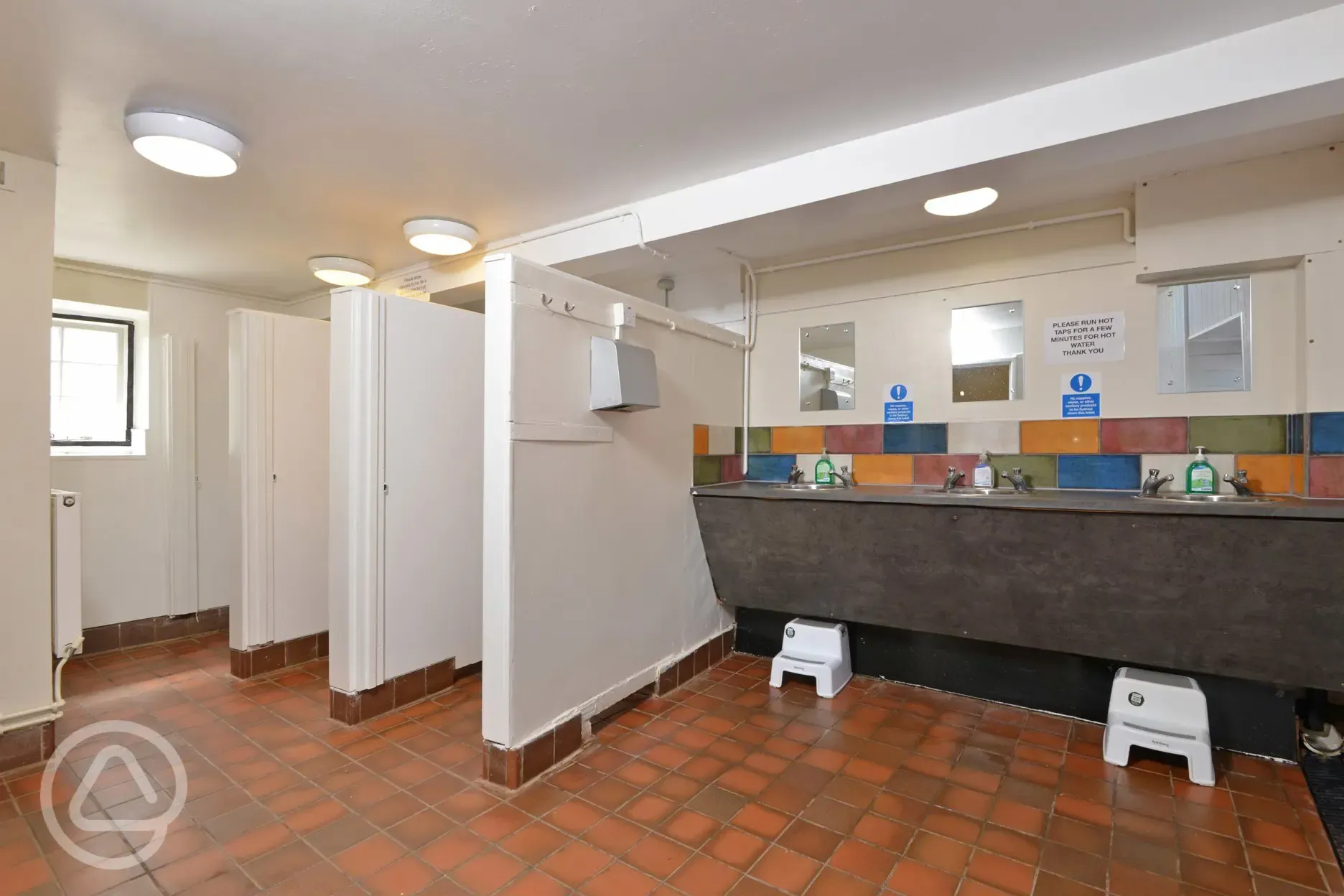 Toilets with hand dryers and steps for children to use
