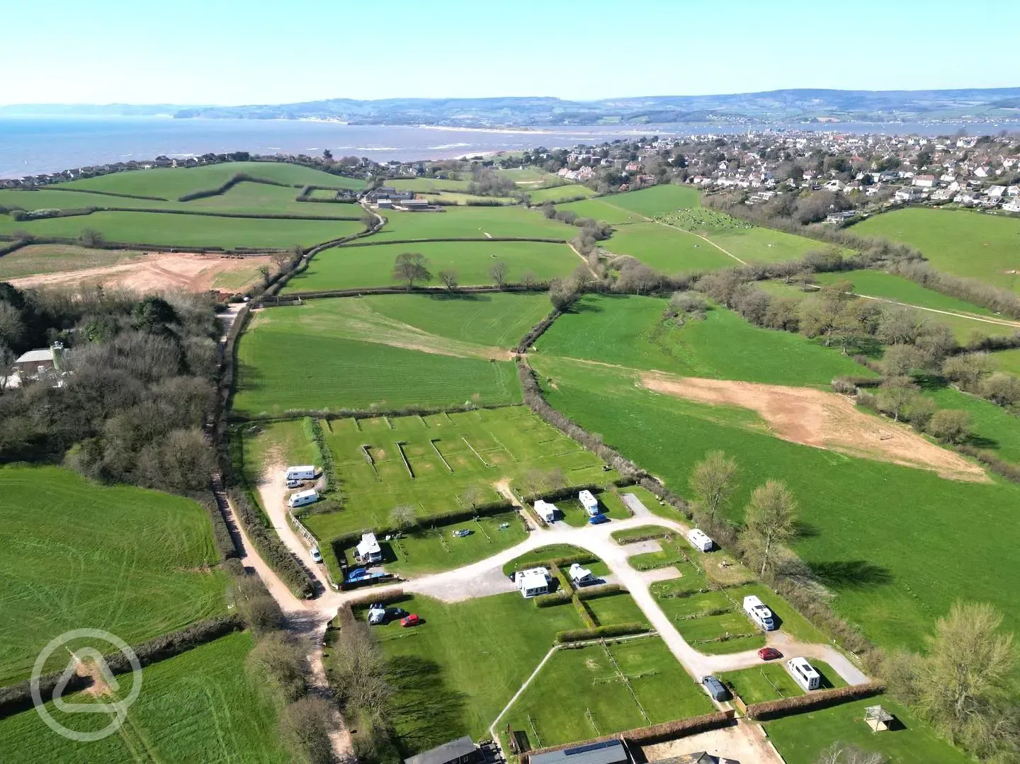 Aerial of Prattshayes Campsite with the coast in the background