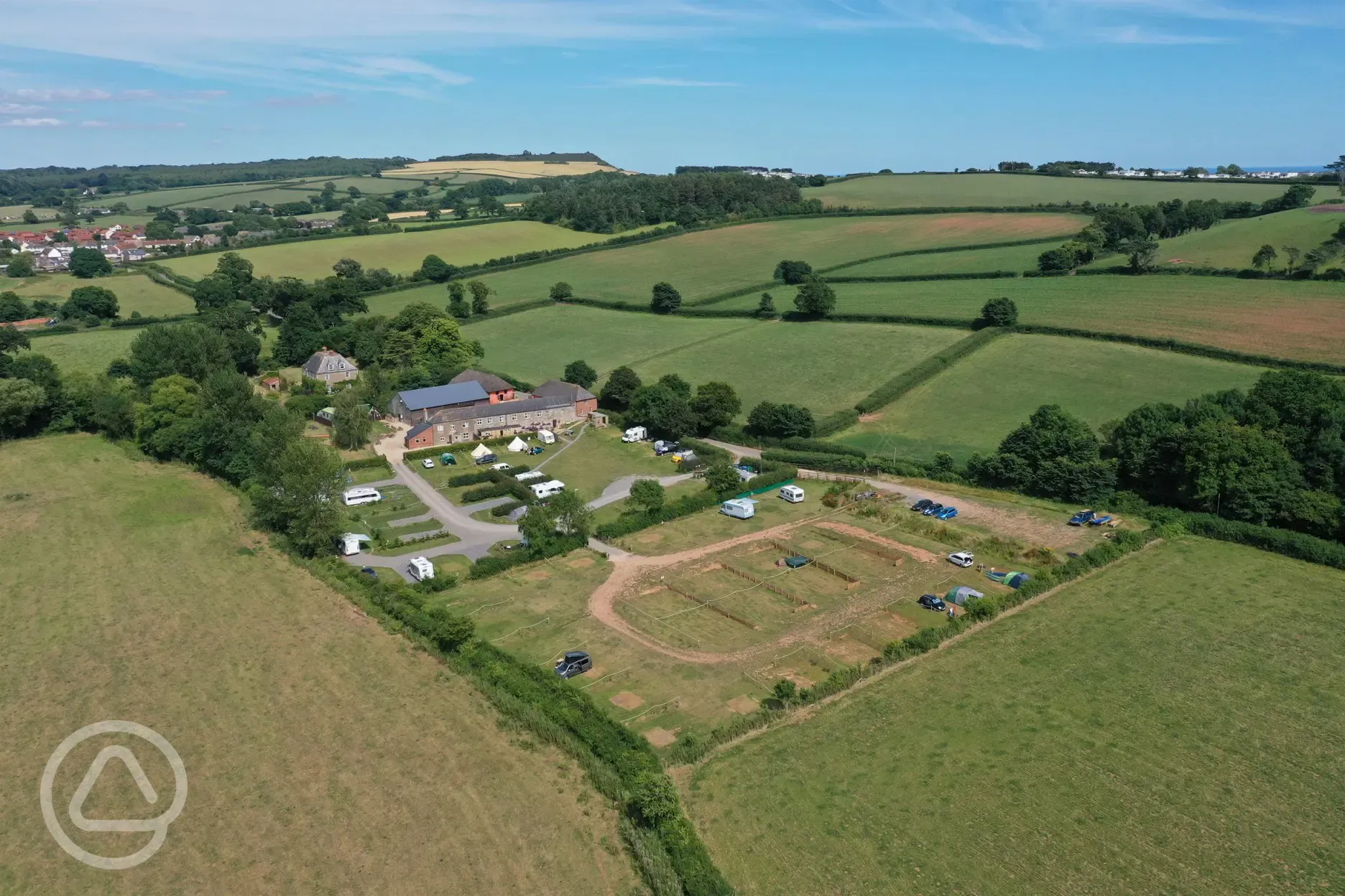 Aerial view of Prattshayes Campsite, inland towards the Devon countryside