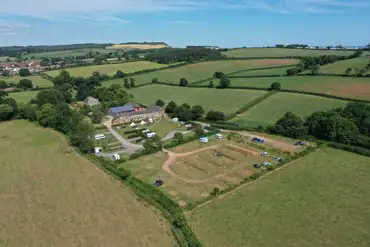 Aerial view of Prattshayes Campsite, inland towards the Devon countryside