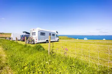 Non electric grass pitches with sea views for tents, roof tents and tourers