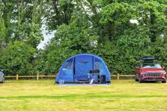 Large electric grass tent pitches (10m x 10m)