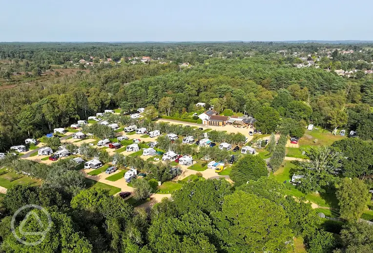 Aerial of Back of Beyond Touring Park surrounded by woodland