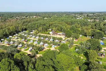 Aerial of Back of Beyond Touring Park surrounded by woodland