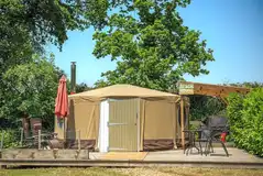 Beach yurt with a decking area and parasol