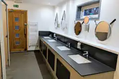 Modern facilities block with toilets and showers