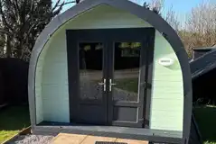 Wooden camping pod with double doors