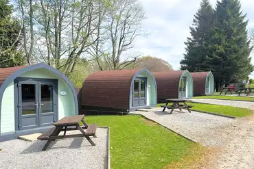 Camping pods with outdoor picnic benches