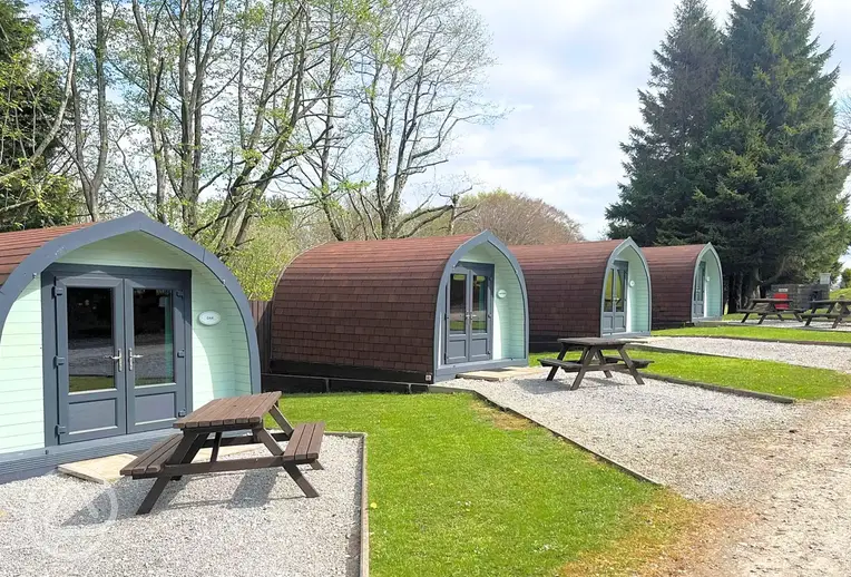 Camping pods with outdoor picnic benches
