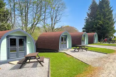 Camping pods with outdoor picnic benches
